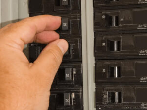 hand of a platinum electric worker fixing the electrical panel in rexburg id