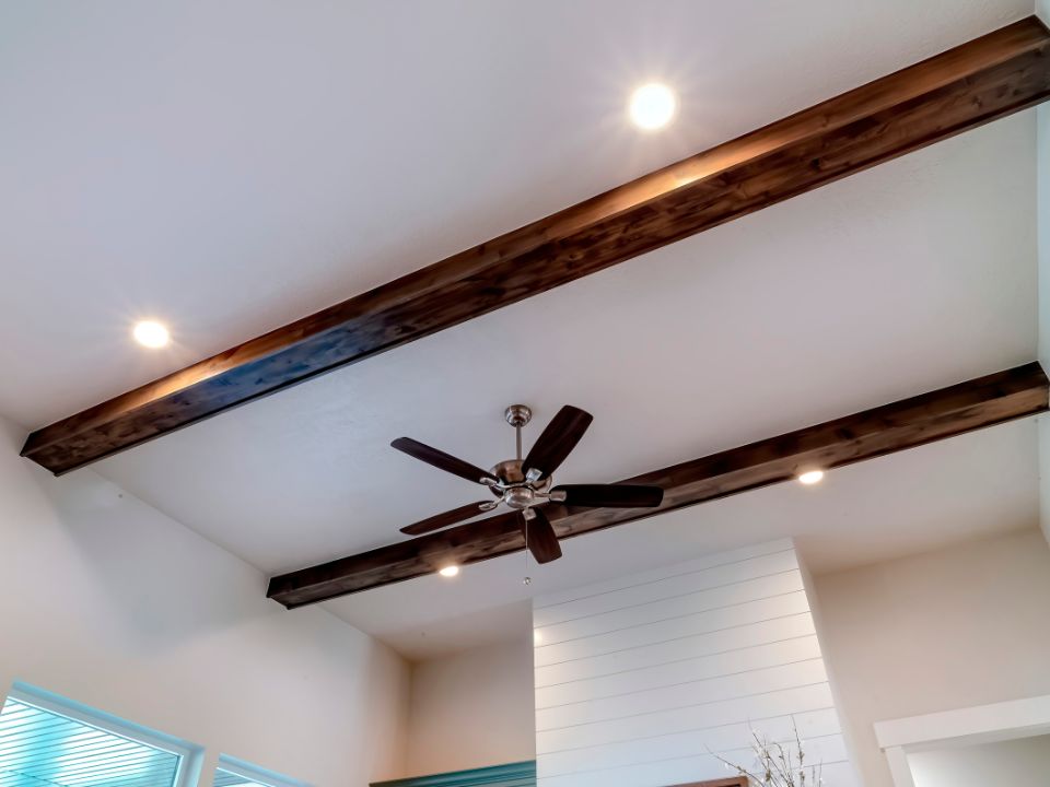 picture of a ceiling with a fan and lights - residential lighting electrician work done by platinum electric - best electrician in rexburg id