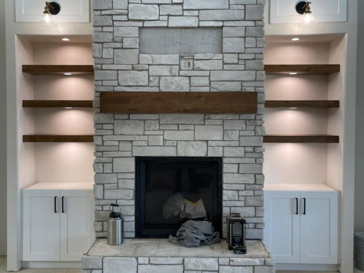lighting besides the chimney in a house - Project done by Platinum Electric